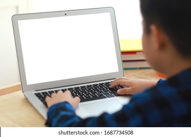 Asian Boy On The Internet With Laptop Computer Doing Homework With Blank Screen