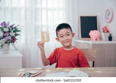 Asian Boy play math number card game at home.Play and learn Education concept - Powered by Shutterstock