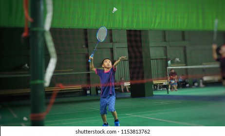 Asian Boy Playing Badminton.(Selected Focus)