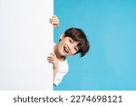 Asian boy portrait on blue background