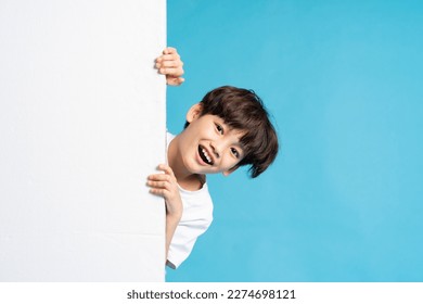 Asian boy portrait on blue background