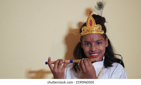 Asian Boy Posing As Shri Krishna Or Kanhaiya On Fancy Dress Or Gokulashtami Festival.