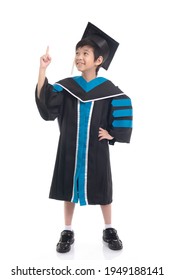 Asian boy student wearing graduation gown pointing finger up on white background isolated