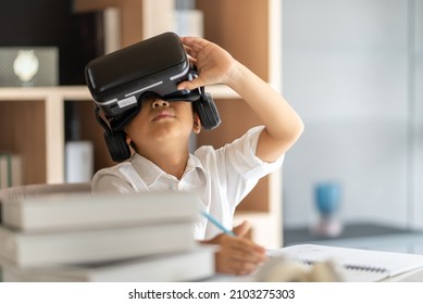 Asian boy study online with VR, virtual reality - Shutterstock ID 2103275303