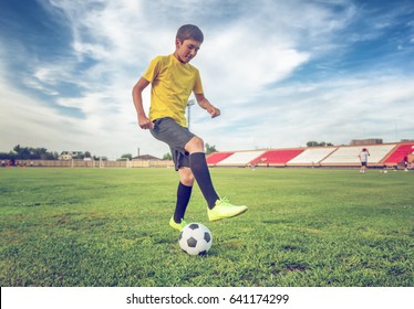 Asian Boy Teenager Playing Football At The Stadium, Sports, Outdoor Activities