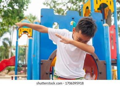 Asian Boy Throwing Dab Move, In The Playground.