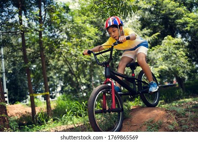 Asian Boy Is Training For A Happy Mountain Biking.