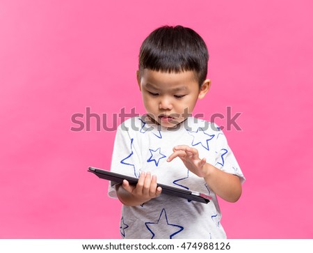 Asian boy using dgital tablet
