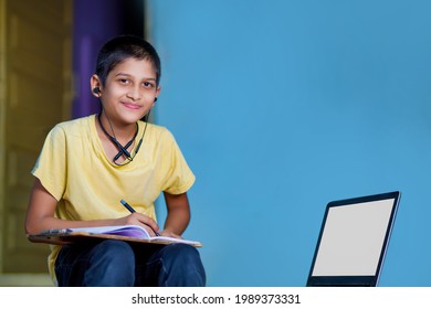 Asian Boy Using Laptop Computer For Online Study Homeschooling During Home Quarantine. Homeschooling, Online Study, Home Quarantine, Online Learning, Corona Virus Or Education Technology Concept