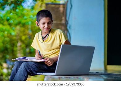 Asian Boy Using Laptop Computer For Online Study Homeschooling During Home Quarantine. Homeschooling, Online Study, Home Quarantine, Online Learning, Corona Virus Or Education Technology Concept