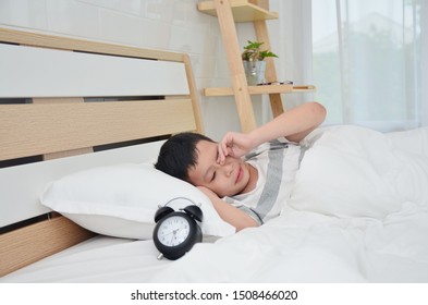 Asian Boy Wake Up At The Bedroom