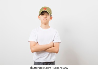 Asian Boy Wearing A Chinese Chairman Mao Zedong Communist Red Army Hat On White Background.