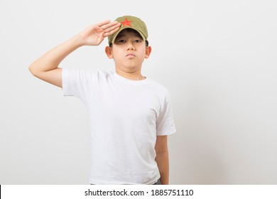 Asian Boy Wearing A Chinese Chairman Mao Zedong Communist Red Army Hat On White Background.