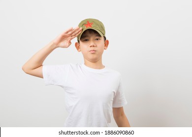 Asian Boy Wearing A Chinese Chairman Mao Zedong Communist Red Army Hat On White Background.