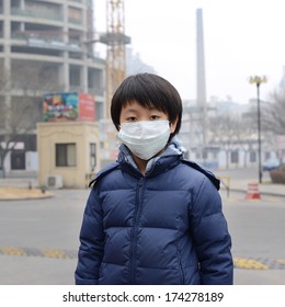 Asian Boy Wearing Mouth Mask Against Air Pollution (Beijing)