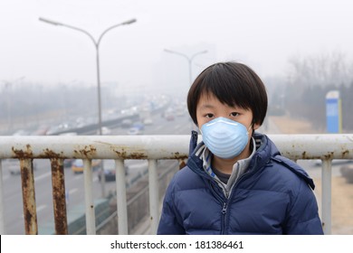 Asian Boy Wearing Mouth Mask Against Air Pollution (Beijing)