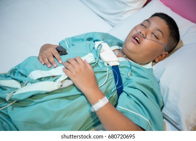 Asian Boy Wearing Sleep Apnea Diagnostic Medical Device Kit. Sleep Test Concept.