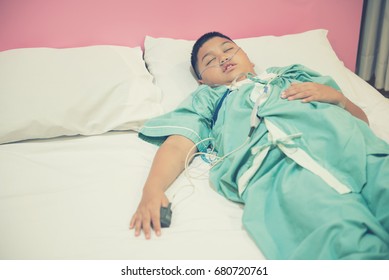 Asian Boy Wearing Sleep Apnea Diagnostic Medical Device Kit. Sleep Test Concept.Vintage Tone.