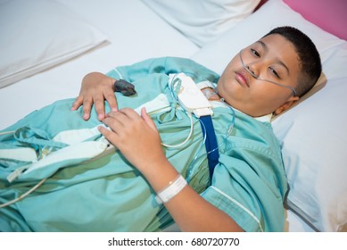 Asian Boy Wearing Sleep Apnea Diagnostic Medical Device Kit. Sleep Test Concept.