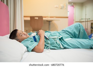 Asian Boy Wearing Sleep Apnea Diagnostic Medical Device Kit. Sleep Test Concept.