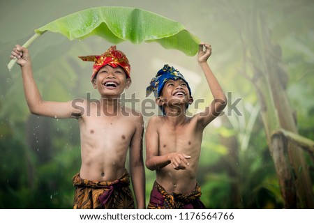 Asian boys teens laughing outdoors romance friendship love in the summer. Happy face and beautiful nature.