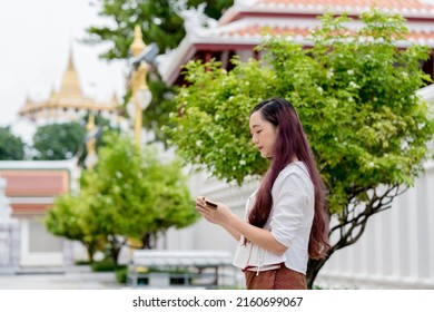 Asian Buddhist Woman Wearing Traditional Dress Of Thailand Reading Sanskrit Ancient Tripitaka Book Of Lord Buddha Dhamma