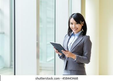 Asian Buisness Woman Use Of Tablet Computer