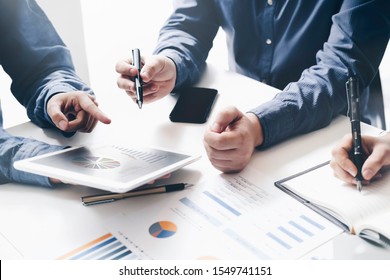 Asian business adviser meeting to analyze and discuss the situation on the financial report in the meeting room.Investment Consultant,Financial Consultant,Financial advisor and accounting concept