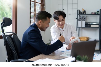 Asian business adviser meeting to analyze and discuss the situation on the financial report in the meeting room.Investment Consultant, Financial advisor and accounting concept - Shutterstock ID 2209412243
