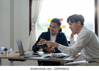Asian business adviser meeting to analyze and discuss the situation on the financial report in the meeting room.Investment Consultant, Financial advisor and accounting concept - Shutterstock ID 2209456615