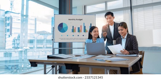 Asian business adviser meeting to analyze and discuss the situation on the financial report in the meeting room. Investment Consultant, Financial advisor and accounting concept - Powered by Shutterstock