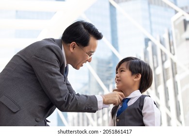 Asian Business Father And Son Confidence Child Want To Be Like A His Dad Parent And Young Boy Standing In City With Cityscape Background Planning In Future Life. 