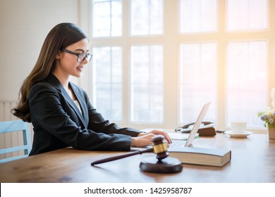 Asian Business Lawyer Woman Working With Computer Laptop In Legal Office.Law And Legal Services Concept.