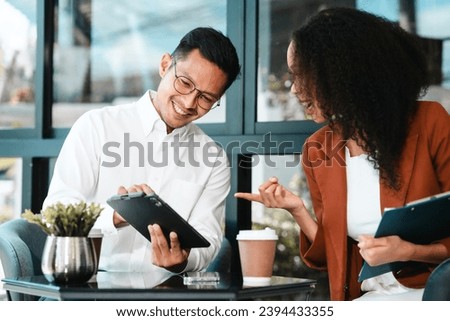 Asian business man and African American woman engaging in business discussion, possibly about merger or joint venture. two companies become one, one of companies often survives while other disappears