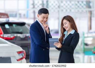 Asian Business Man Bargain Purchasing Brand New Car, Car Rental Business In Auto Showroom