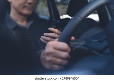 Asian Business Man, Driver Using Mobile Smart Phone Inside A Car, Checking Direction Via Transport Application, Gps Or Navigator Before Driving Car, Close Up