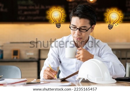 Asian business man having a good idea. A lighted light bulb. new idea, thinking, innovation, creative, plan strategy and solution concept.
