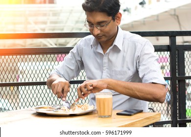 Asian Business Man Having Roti Canai Outdoor