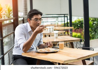 Asian Business Man Having Roti Canai Outdoor