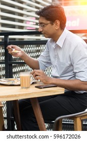 Asian Business Man Having Roti Canai Outdoor