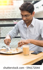 Asian Business Man Having Roti Canai Outdoor