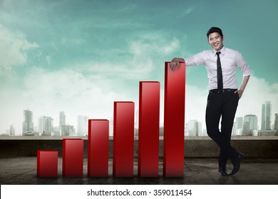 Asian Business Man Leaning To Increasing Graph