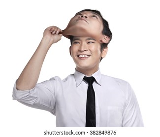 Asian business man remove his other face mask. Changing mood concept - Powered by Shutterstock