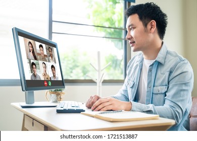 Asian Business Man Talking To Colleague Team About Plan In Video Conference. Group Of Business People Using Computer For Remote Online Meeting In Video Call Conference. Smart Working From Home.