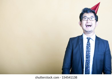 Asian Business Man Wearing Party Hat