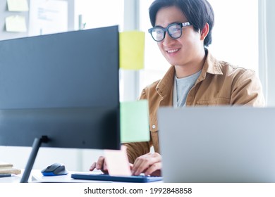 Asian business man working with computer in office