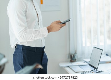 Asian Business man working with laptop. Young business man thinking Concentrated at work - Powered by Shutterstock