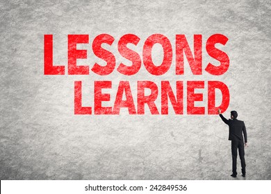 Asian business man write words on wall, Lessons Learned