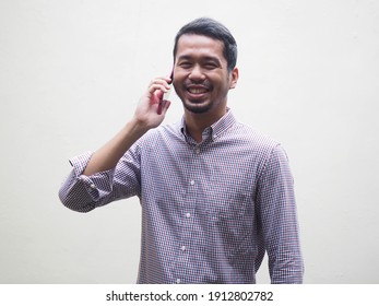 Asian Business Men Smiling To The Camera While Talking On The Phone Isolated On White