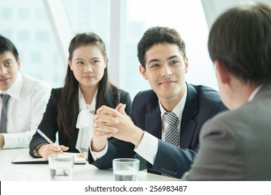 Asian Business People Discussing In The Meeting Room